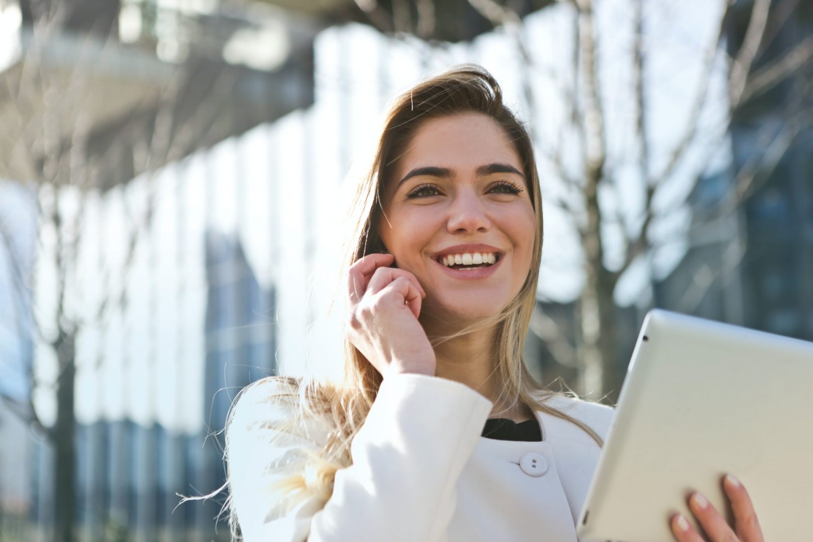 Person smiling while on a phone call
